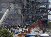 Rescuers search for survivors from 2021's Florida apartment-building collapse.