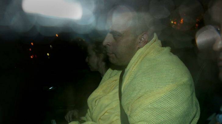 The man charged with murder being driven from Broadmeadows police station. Photo: Pat Scala