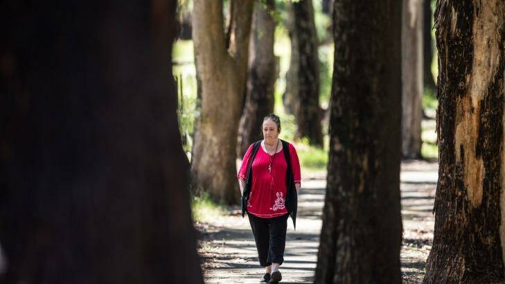 Lesley Bebbington walks among the trees around Kinglake. Photo: Jason South