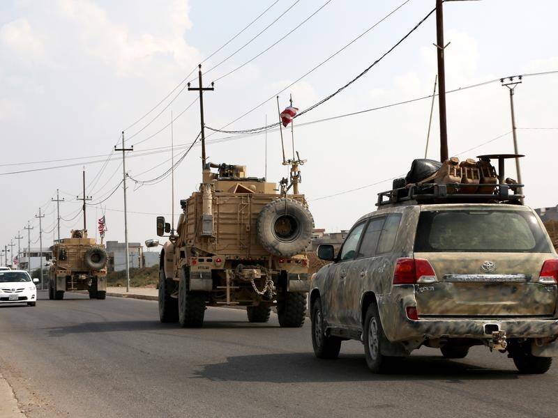 A convoy of US troops has arrived back in Iraq from northeastern of Syria.