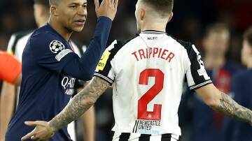Kylian Mbappe argues with Newcastle's Kieran Trippier after PSG were awarded a debatable penalty. (EPA PHOTO)