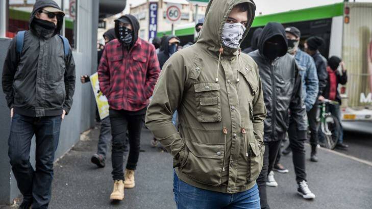 Masked protesters in Coburg on Saturday. Photo: Mathew Lynn
