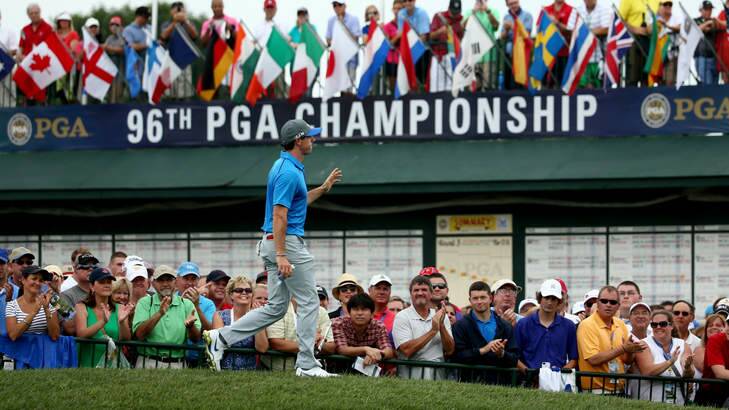 Rory McIlroy of Northern Ireland waves to fans as he walks to the first hole. Photo: Getty Images