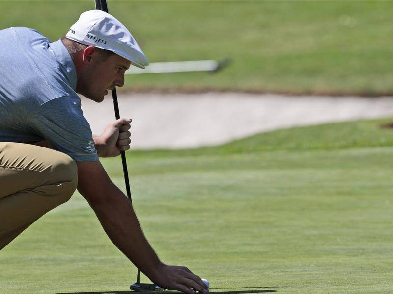 Bryson DeChambeau leads at the halfway point of the World Golf Championship in Mexico City.