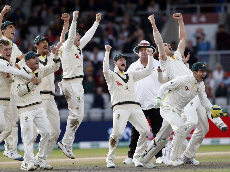 Steve Smith (c) and his Australian teammates celebrate their Ashes triumph at Old Trafford.