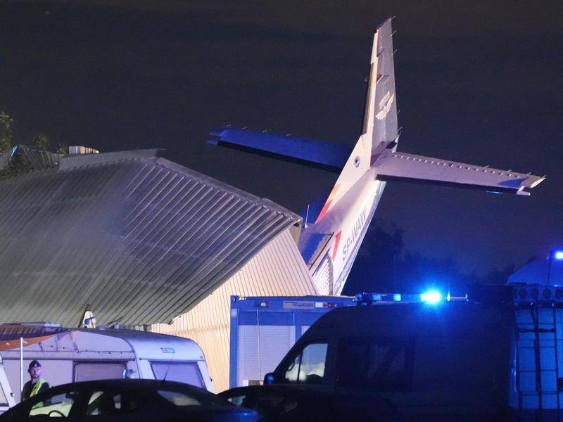 The Cessna 208 plane crashed into a hangar during bad weather in Poland, killing five people. (AP PHOTO)