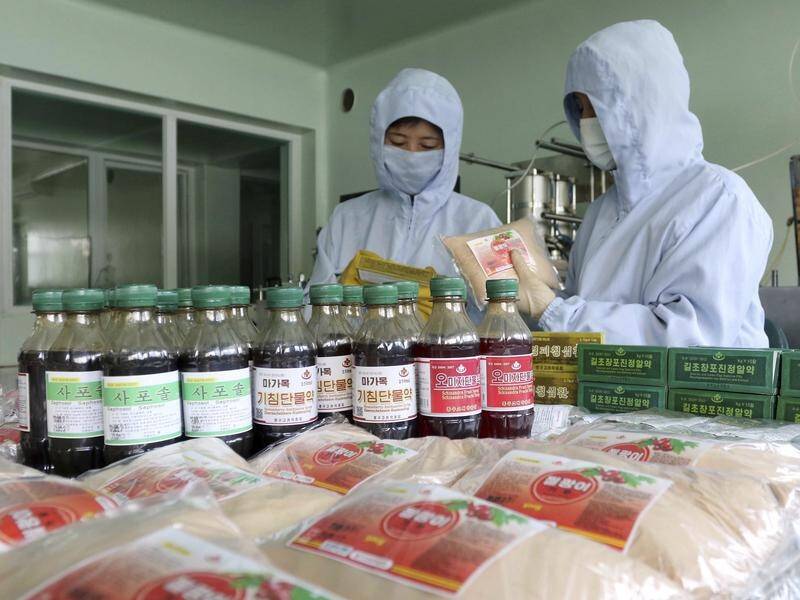 Homegrown medicines and the socialist system have helped beat COVID-19, North Korean officials say. (AP PHOTO)