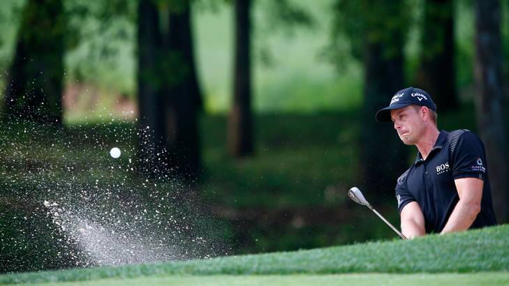 Bunker to bunker, the avenue was packed: Henrik Stenson of Sweden chips from a bunker to the eighth green during the final round of the 96th PGA Championship at Valhalla. Photo: Getty Images