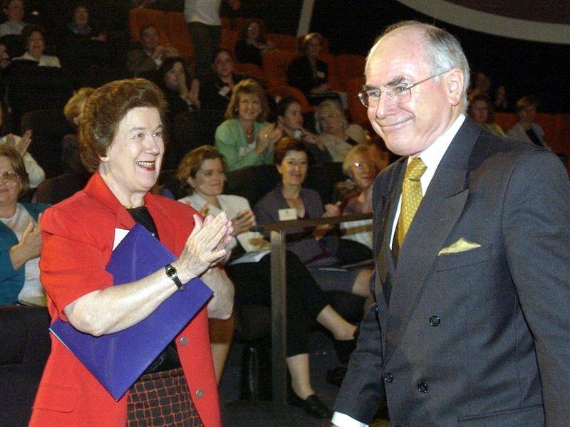 Dame Margaret Guilfoyle, who has died aged 94, applauds former prime minister John Howard in 2002.