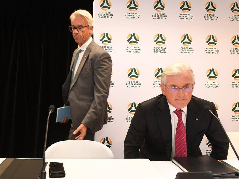 FFA CEO David Gallop (left) joins outgoing chairman Steven Lowy at the FFA AGM in Sydney.