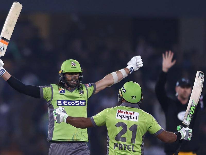 Lahore Qalandars batsman David Wiese (l) celebrates his side's PSL win against Peshawar .