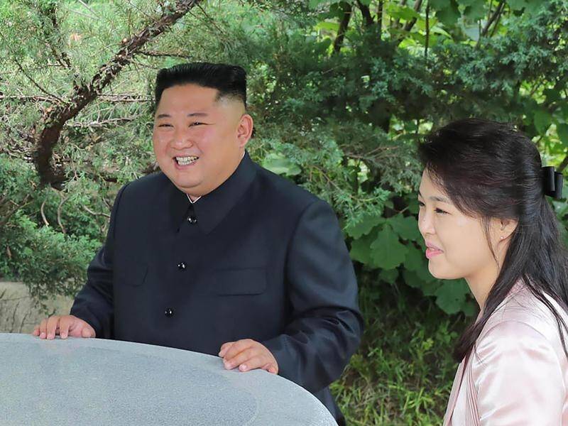North Korea's Kim Jong-un (R) is mulling the "excellent" letter from Donald Trump.