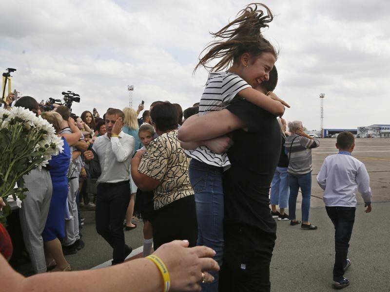 Relatives in Kiev greeted Ukrainian prisoners freed by Russia as part of a prisoner swap deal.