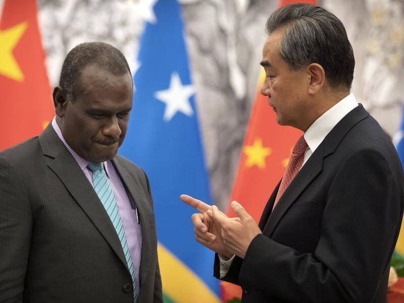 Solomon Islands Foreign Minister Jeremiah Manele and his Chinese counterpart Wang Yi in September. (AP PHOTO)
