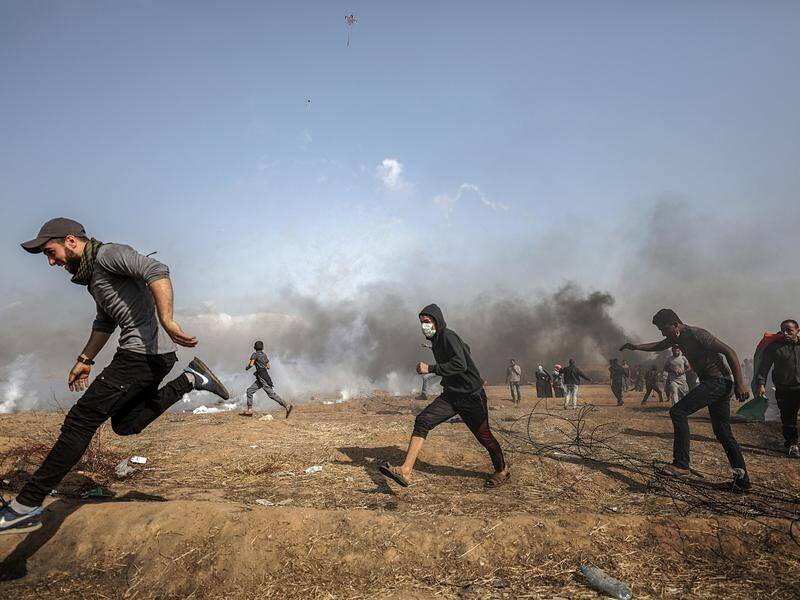 Three Palestinians have been shot dead by Israeli troops during clashes along the Gaza border.