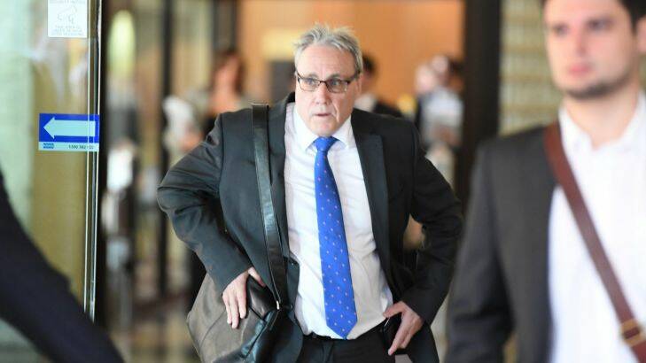 SMH News story by Rachel Olding. Story:  First court appearance for ATO tax fraud people - Michael Cranston, Lauren Cranston and Daniel Hausman, Downing Centre Court, Sydney. Photo shows,    Michael Cranston leaves court. Photo by, Peter Rae Tuesday 13 June, 2017