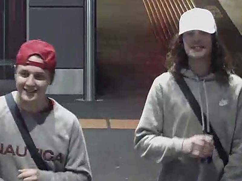 Two men are wanted for questioning over the bashing of a Victoria Police assistant commissioner.
