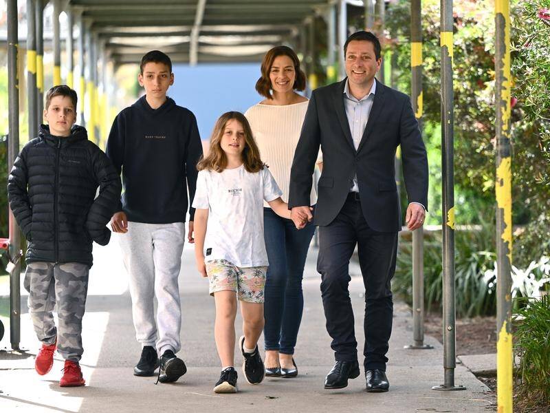 Opposition Leader Matthew Guy has cast his vote, accompanied by wife Renae and their children. (Joel Carrett/AAP PHOTOS)