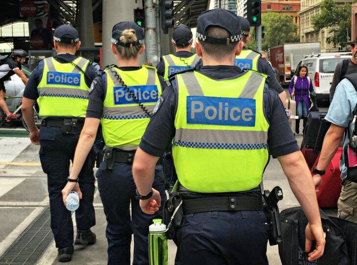 MELBOURNE, AUSTRALIA - FEBRUARY 22: A large group of uniformed members of Victoria Police on patrol at Southern Cross Station in Melbourne, Australia on 22nd February, 2016 (Photo by Paul Rovere/Fairfax Media) Generic police. Shot with iPhone Generic Victoria Police, police officer, police officers, policemen, police man, police woman Police Generics