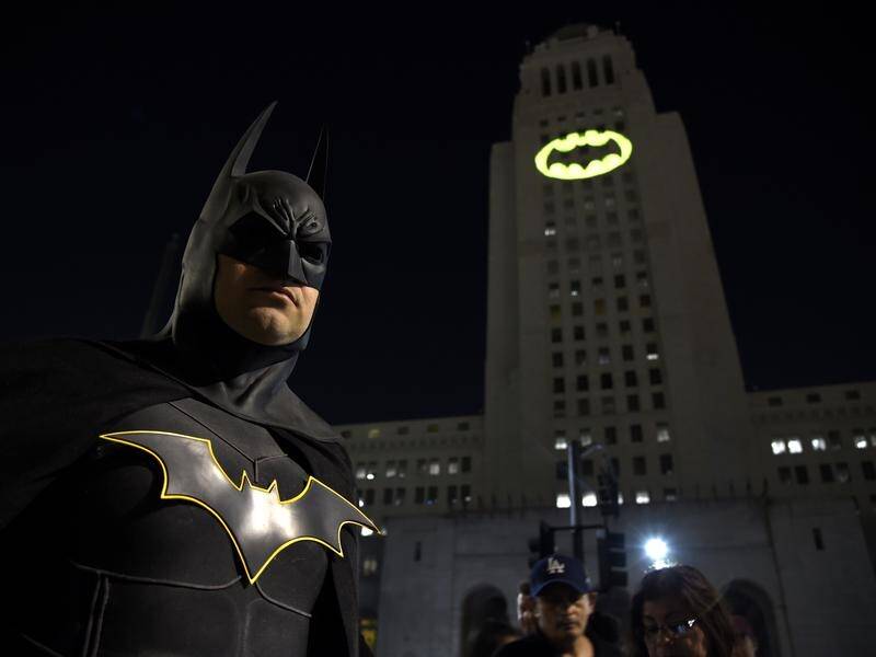 Landmarks have been illuminated with the famous bat insignia to mark Batman's 80th anniversary.