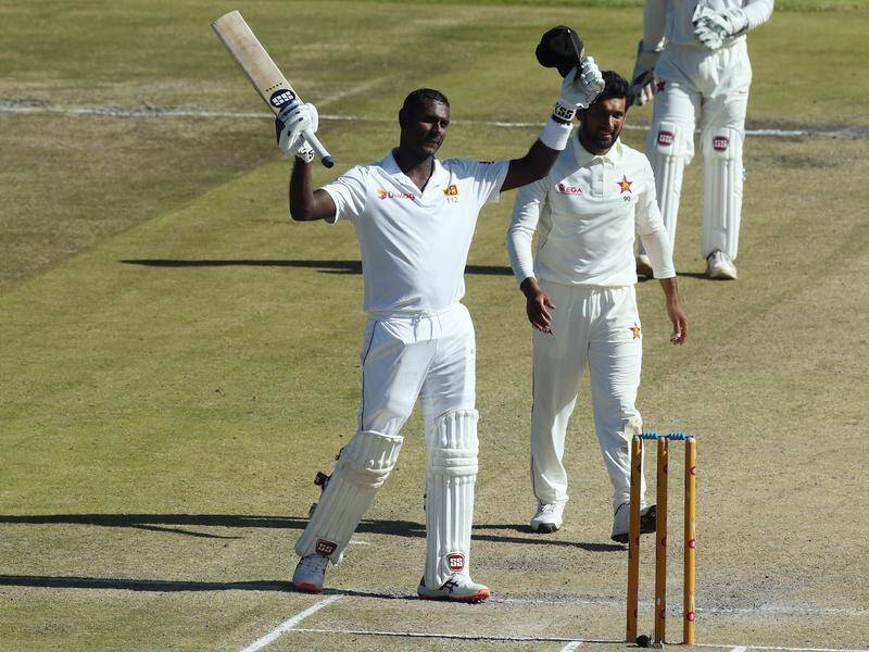 Sri Lanka's Angelo Mathews (C) has hit a maiden double-century in the first Test with Zimbabwe.