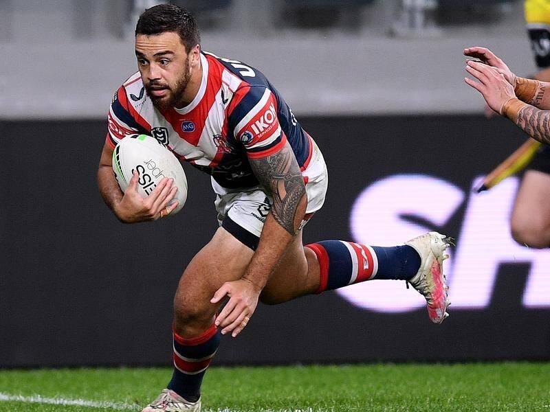Matt Ikuvalu (l) has signed with Cronulla, ending his NRL spell with the Sydney Roosters.
