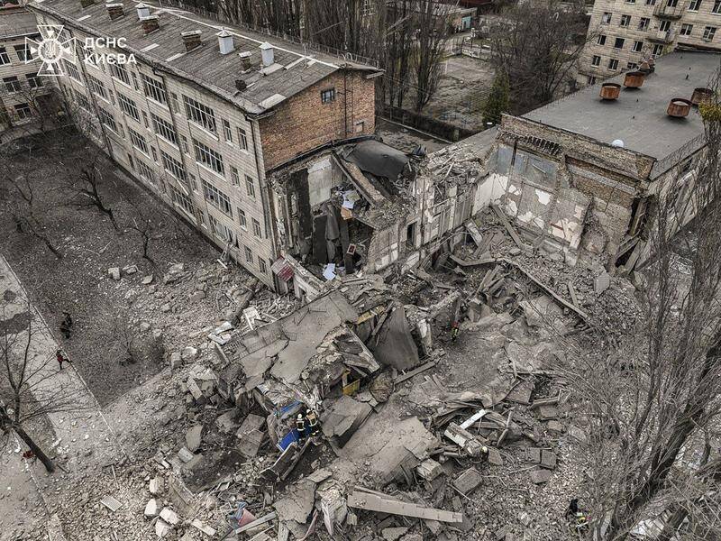 A three-story building housing a gym has been damaged in a Russian rocket in Kyiv, officials say. (EPA PHOTO)