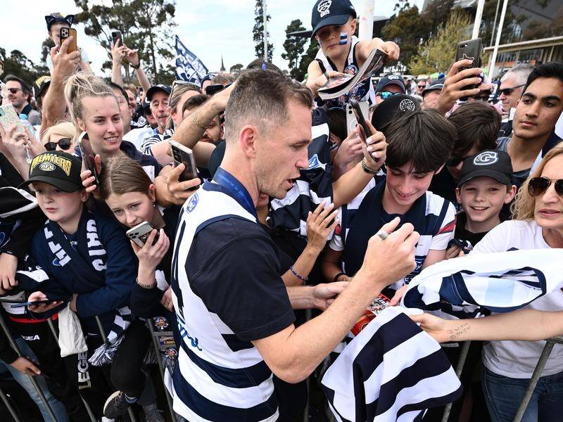 Joel Selwood gave Geelong water boy Sam Moorfoot the thrill of his life with a lap of the MCG. (Joel Carrett/AAP PHOTOS)