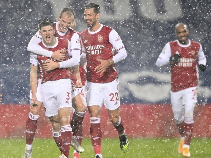 Arsenal players celebrate Kieran Tierney's stunning opener in the 4-0 thrashing of West Brom.