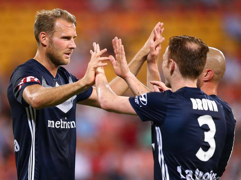 Melbourne Victory players celebrate Ola Toivonen's Round 8 A-League goal against Brisbane.