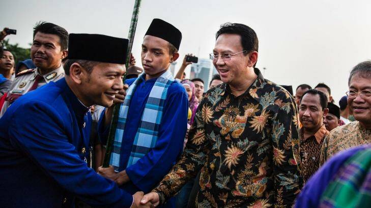 Ahok, right, greets people in Jakarta in 2014. A Christian and ethnic Chinese, he became governor after his predecessor and political ally Joko Widodo was elected president of Indonesia. Photo: New York Times