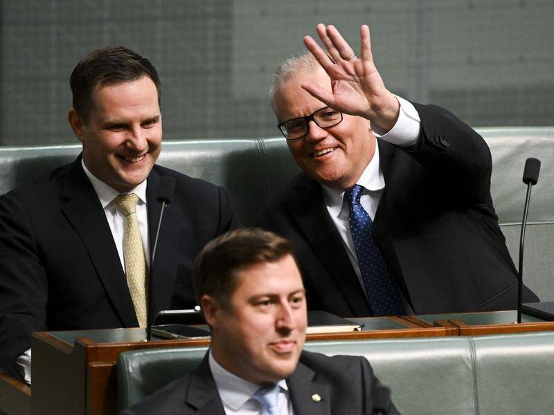 Alex Hawke (L) and former prime minister Scott Morrison during Question Time in Canberra. (Lukas Coch/AAP PHOTOS)