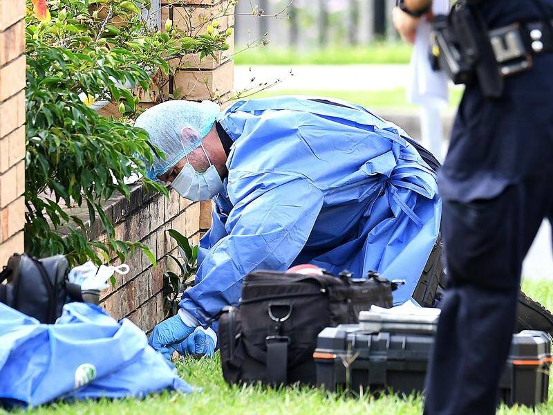 Forensic officers have examined the grounds of a Brisbane block where a young man was fatally shot.