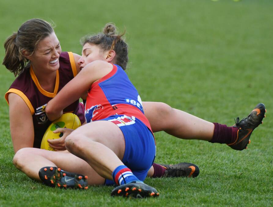COMPETITIVE: Redan's Carly Twaits and East Point's Claire Bourdon fight for possession of the ball early on in the women's grand final. Picture: Kate Healy