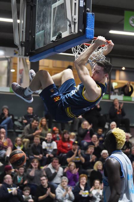 DUNK: Ballarat Miner Nic Pozoglou enjoyed one of his best games for the season, impressing the home crowd with his strength and athleticism. Picture: Kate Healy