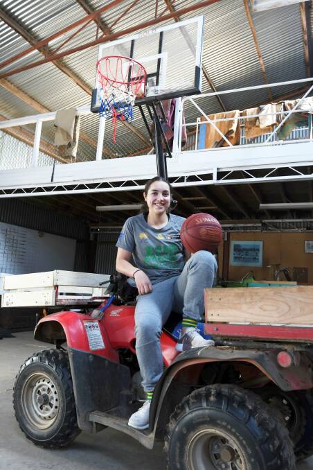 RISING STAR: Georgia Amoore spends many hours in her shed practising her basketball skills. Now all the hard work is paying off. Picture: Lachlan Bence