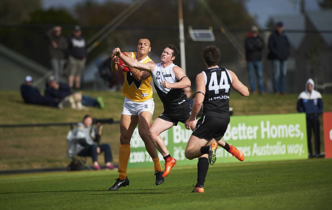 Roosters ruckman Nick Nott in a contest against Werribee in North Ballarat's previous match before the bye. Picture: Luka Kauzlaric