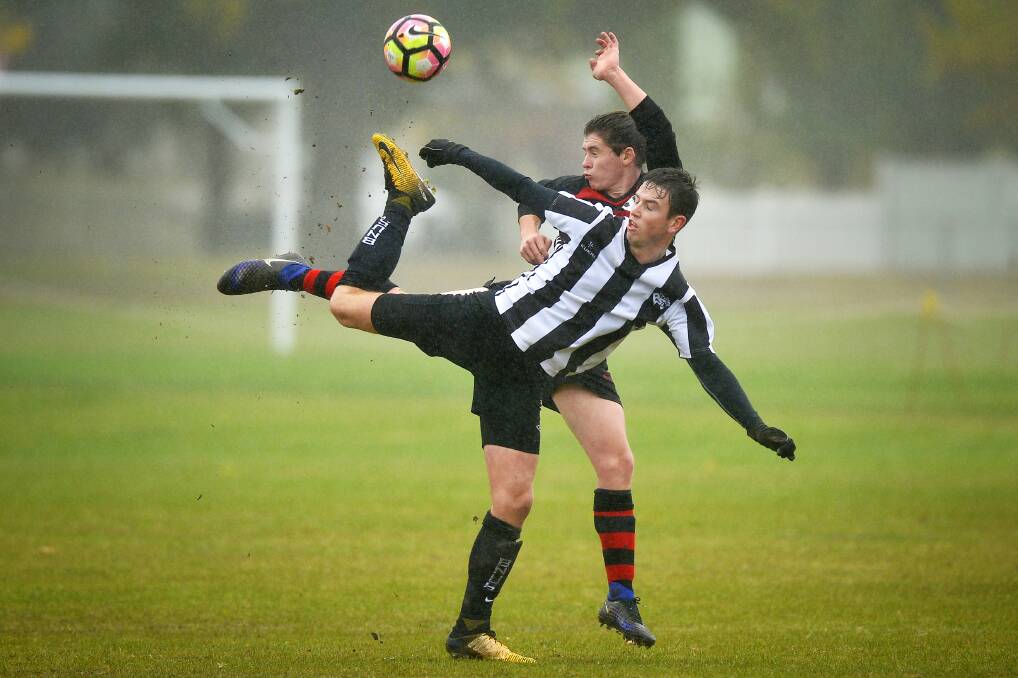 Ballarat North United's Oliver Richardson and Ethan Duggan of Buninyong in round two. Picture: Dylan Burns  