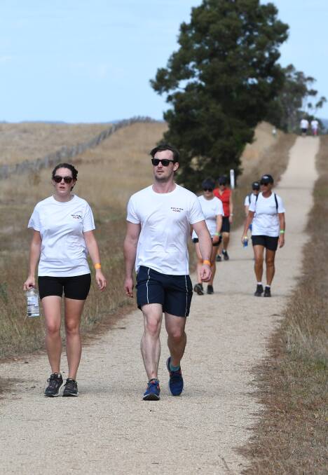 RIGHT DIRECTION: Rebekah Mangos and Daniel Powell make their way towards Victoria Park as part of SalvoConnect Western's Walking Home fundraiser. Picture: Kate Healy
