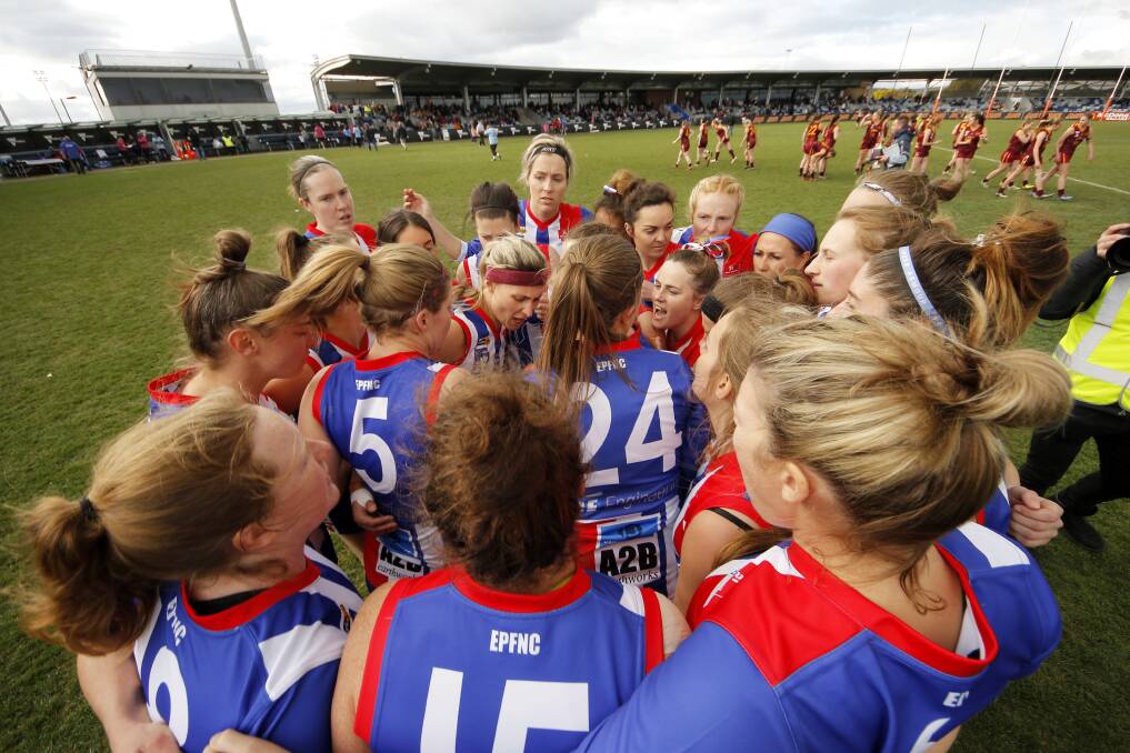 GAME ON: East Point players rev up in a huddle as the women's game kicks off as the finale of female football's grand final day. Picture: Dylan Burns 