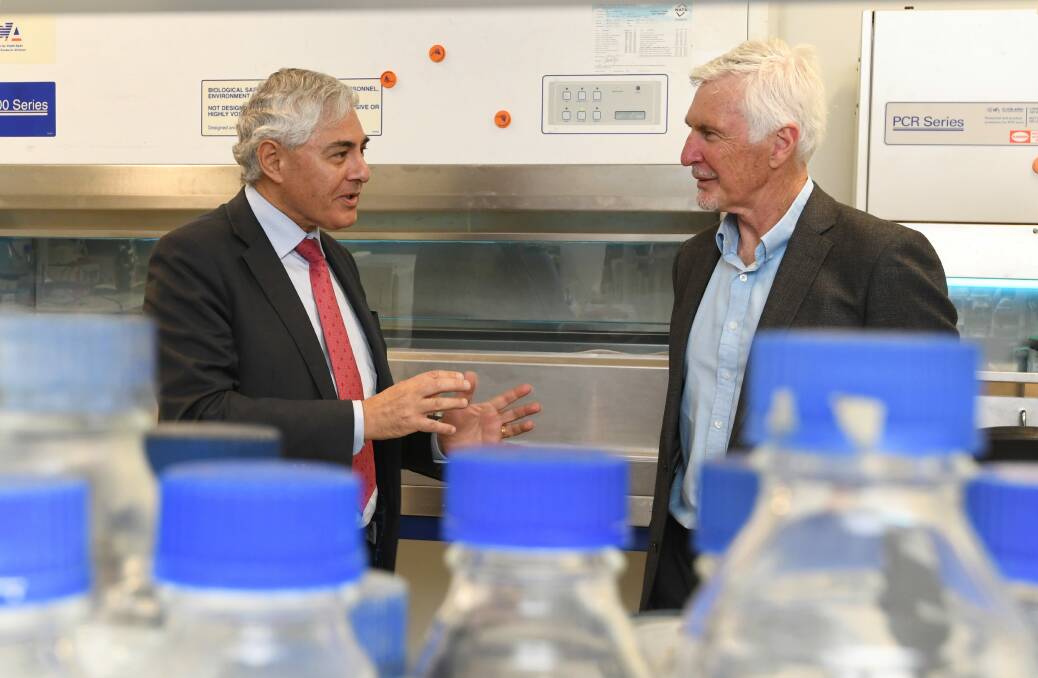 ON BOARD: FECRI research director Professor George Kannourakis with AFL premiership player and coach Mick Malthouse during a tour of the institute's facilities on Friday morning. Picture: Lachlan Bence