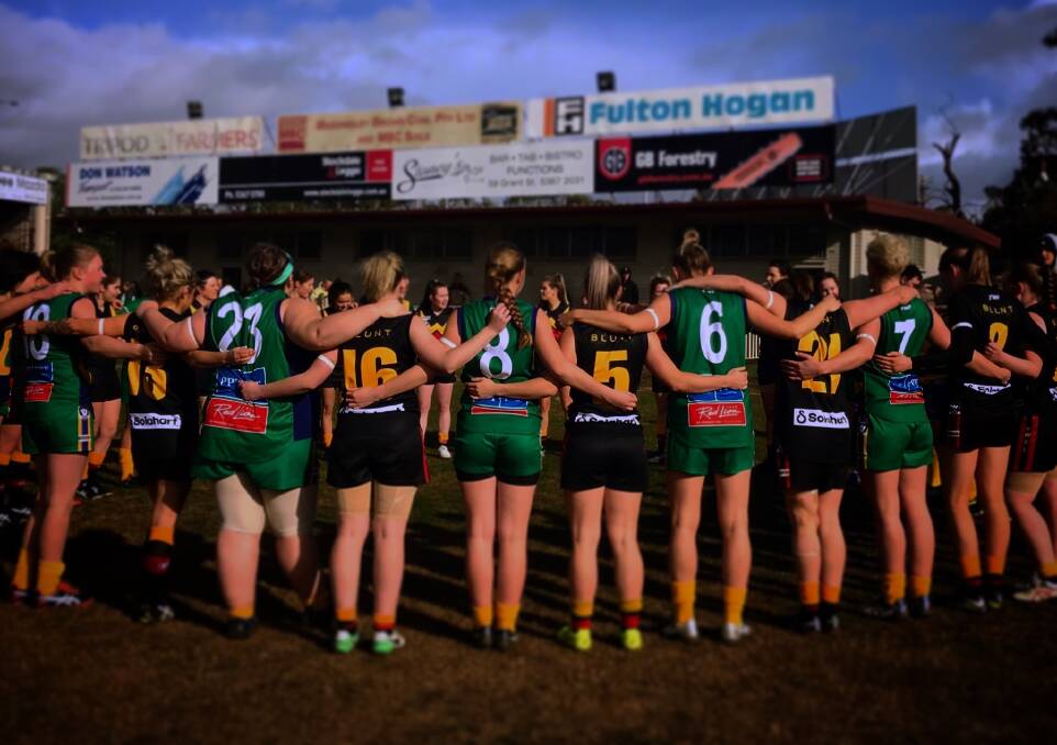 MOVING IMAGE: Lake Wendouree and Bacchus Marsh players stand arm in arm to honour the life of Eurydice Dixon before their game. Picture: Robyn Fraser