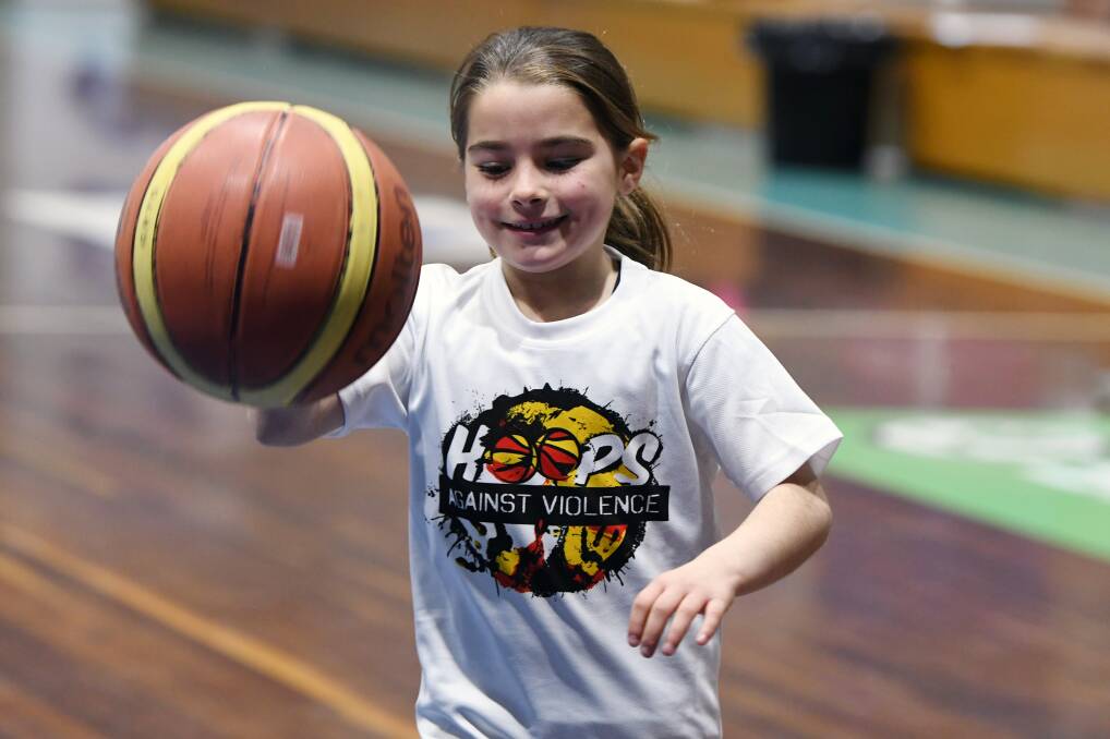 HAVING FUN: Young Brydee Craig-Peters, 9, took part in the Hoops Against Violence basketball program on Monday at the Minerdome. Picture: Kate Healy