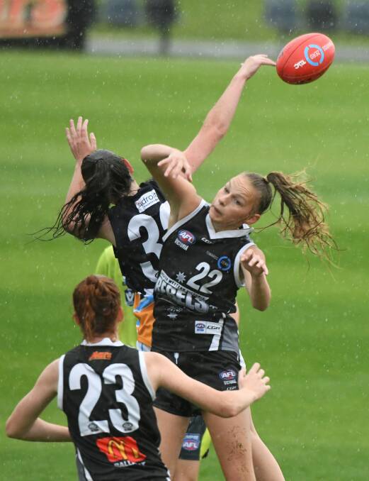 TAKING FLIGHT: Greater Western Victoria Rebel Isabelle Rustman in the ruck contest during the win against Bendigo Pioneers last week. Picture: Lachlan Bence