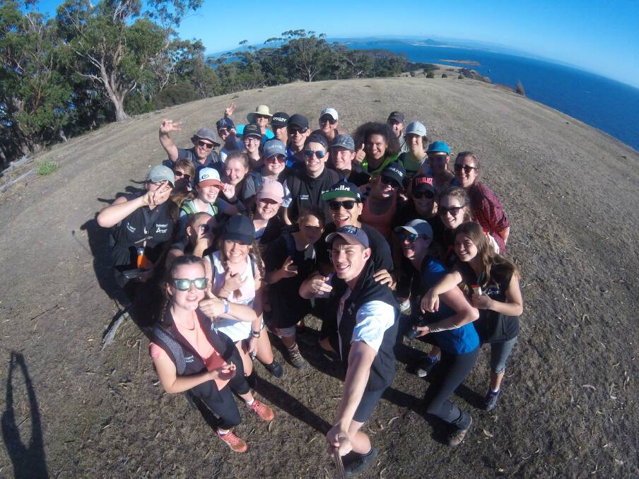 SELFIE TIME: Wonthaggi Secondary College and Ararat College students stopped to take a snap at the top of a mountain peak during their camp in Tasmania.
