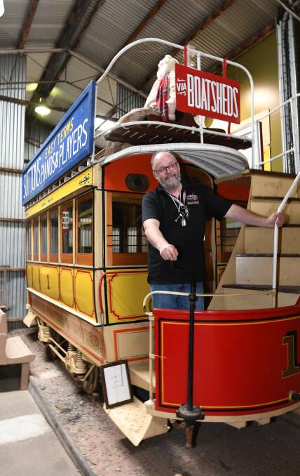 PIECE OF HISTORY: The Ballarat Tramway Museum's marketing manager Peter Waugh stands on Australia's oldest working tram. Picture: Lachlan Bence