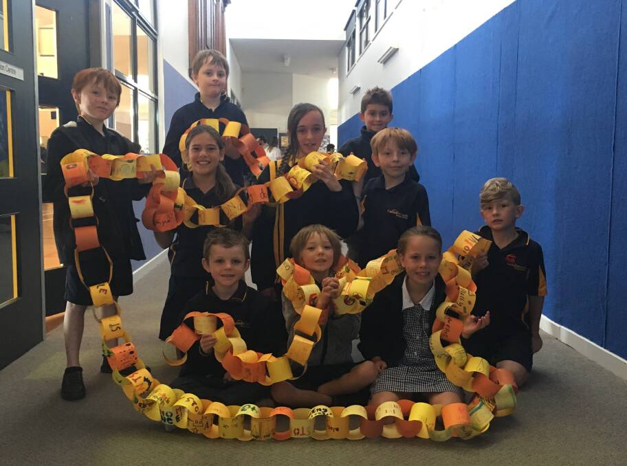 Pupils at Canadian Lead Primary School with the messages of hope paper chain.