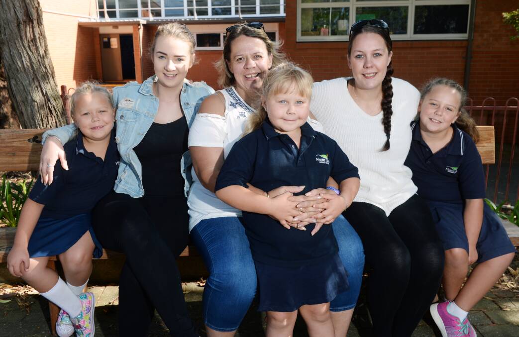 HAPPY FAMILY: Lillymae Crawford, year 3, Syndelle Exon, 18, Sonia Crawford, Rubygrace Crawford, prep, Rhiannon Exon, 23, and Mollyrose Crawford, year 5. Eldest son Nathan Cassidy now lives in Western Australia. Picture: Kate Healy 