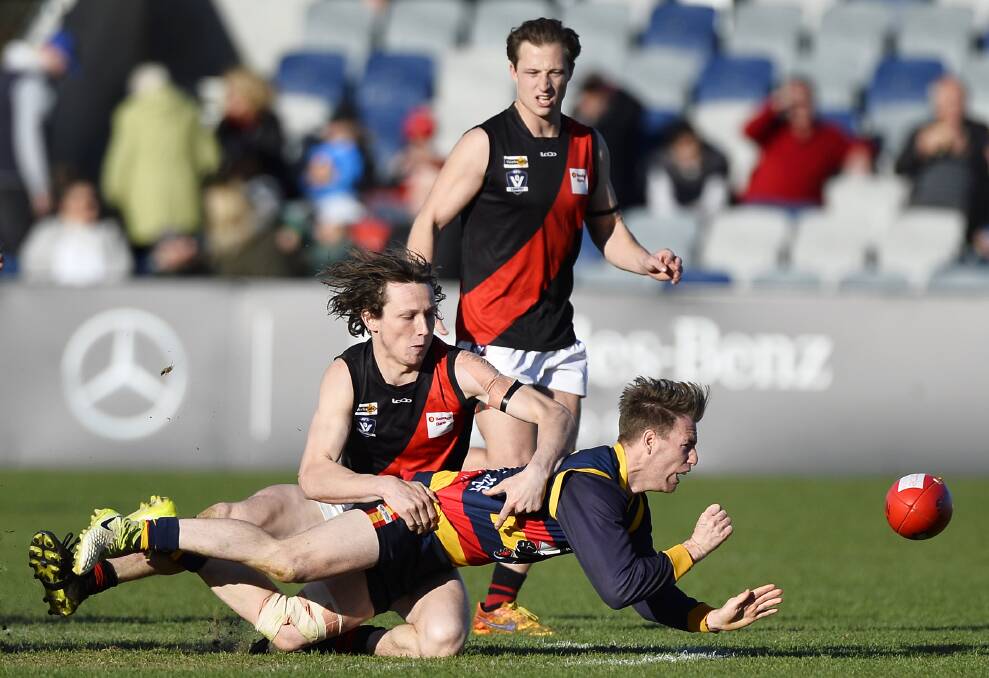 LAST YEAR'S WINNER: Buninyong onballer Jacob Coxall, tackling Michael Foster, was one of the Bombers' best players in a grand final loss on Saturday. Picture: Dylan Burns