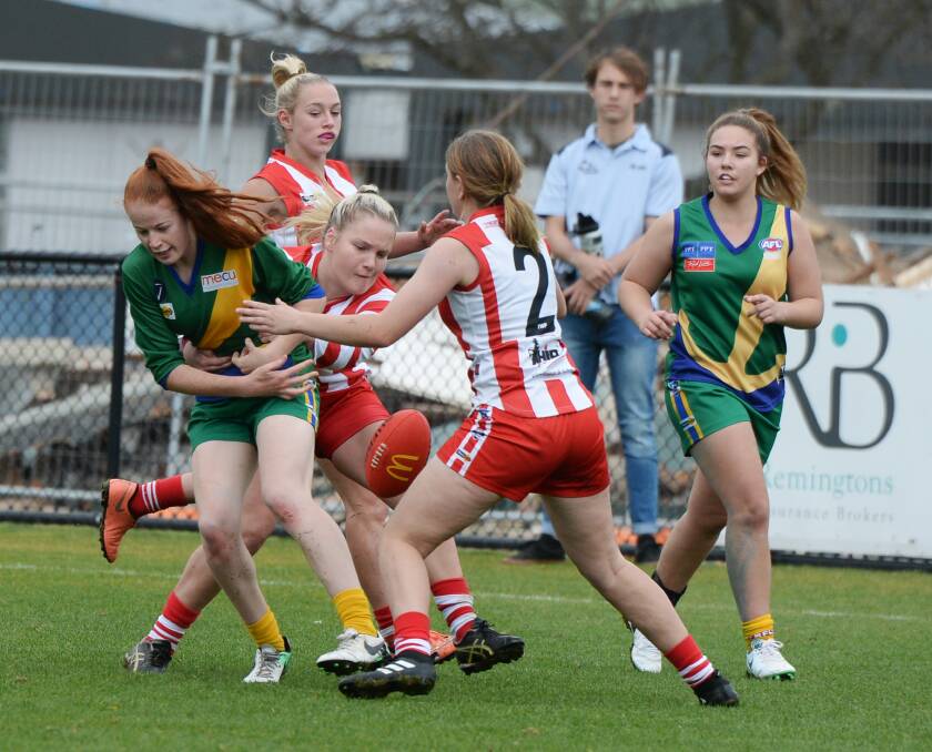 DISPOSSESSED: Sophie Molan from the Lakers gets caught in a tackle from Ballarat Swans' Georgia Pidgeon at CE Brown Reserve.